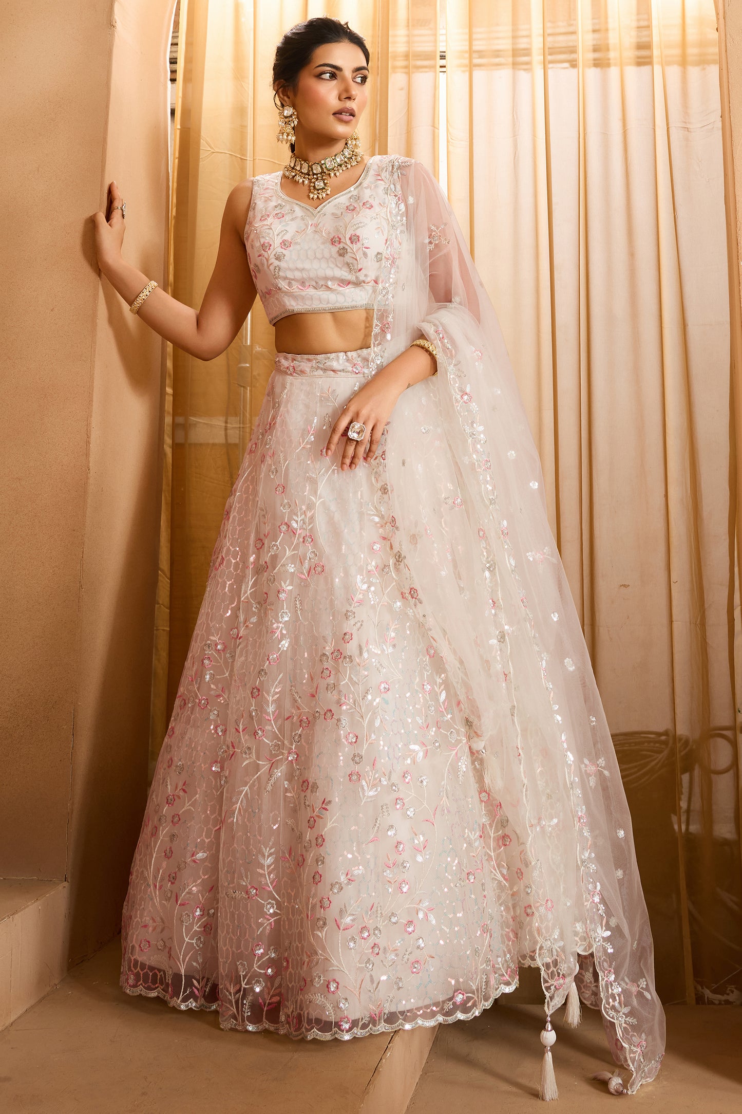 Off White Semi-Stitched Embroidered Net Lehenga